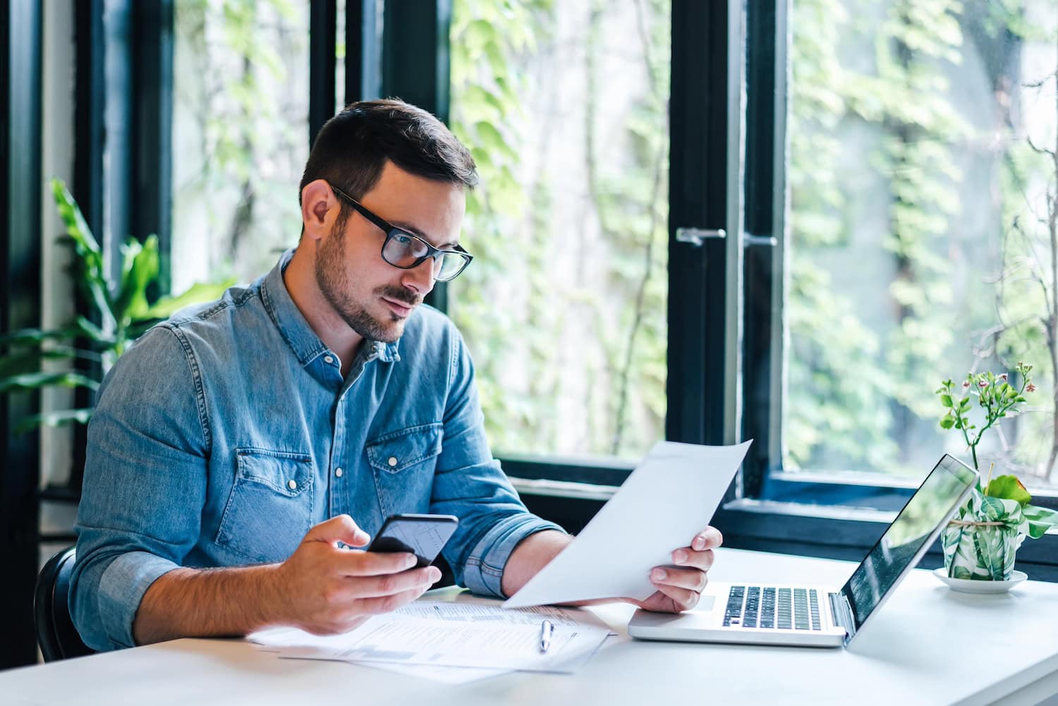 man looking at paper for business