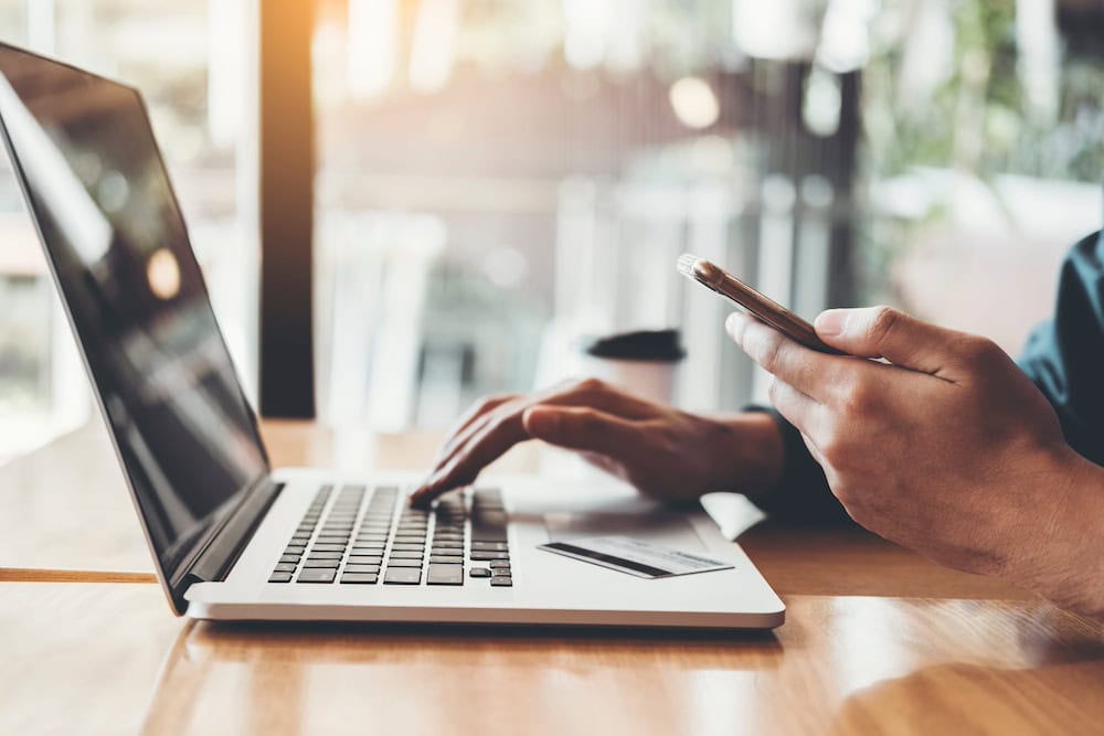 laptop with hands typing